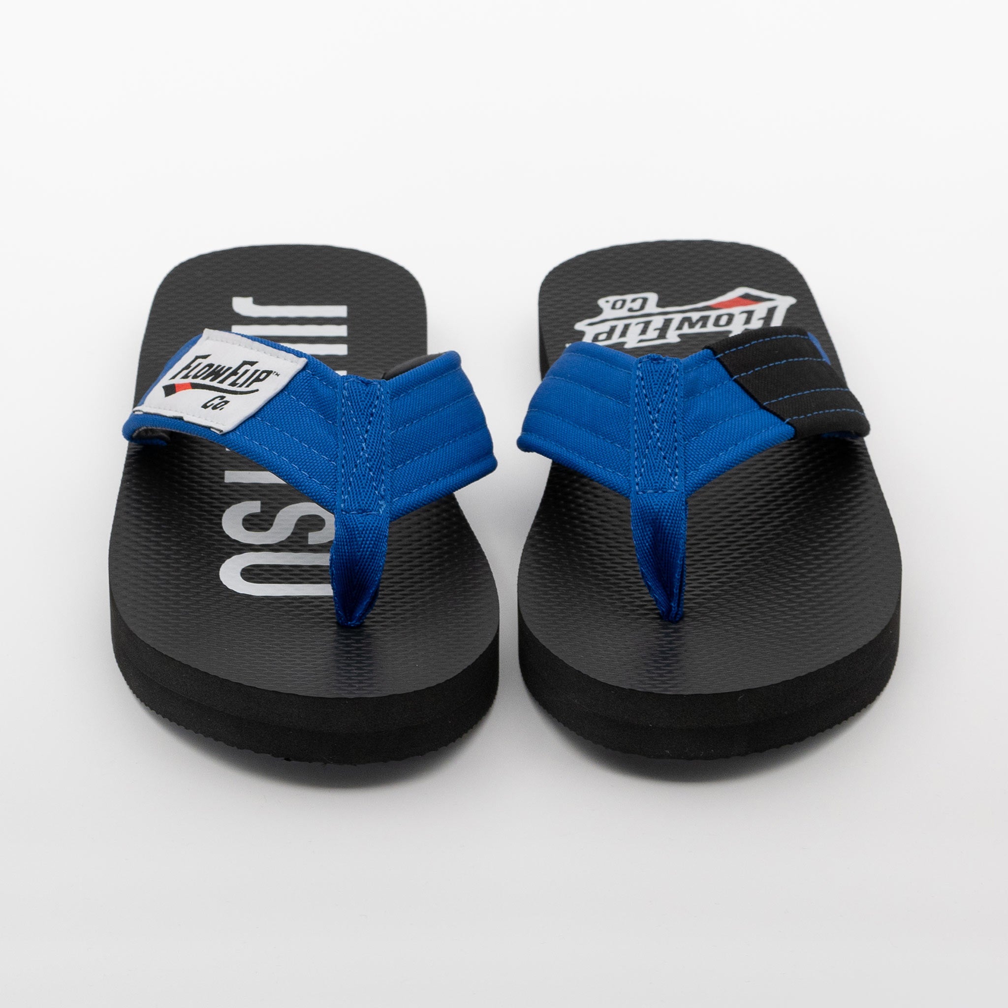 Front view of blue belt BJJ flip flops with blue strap and black rank bar.