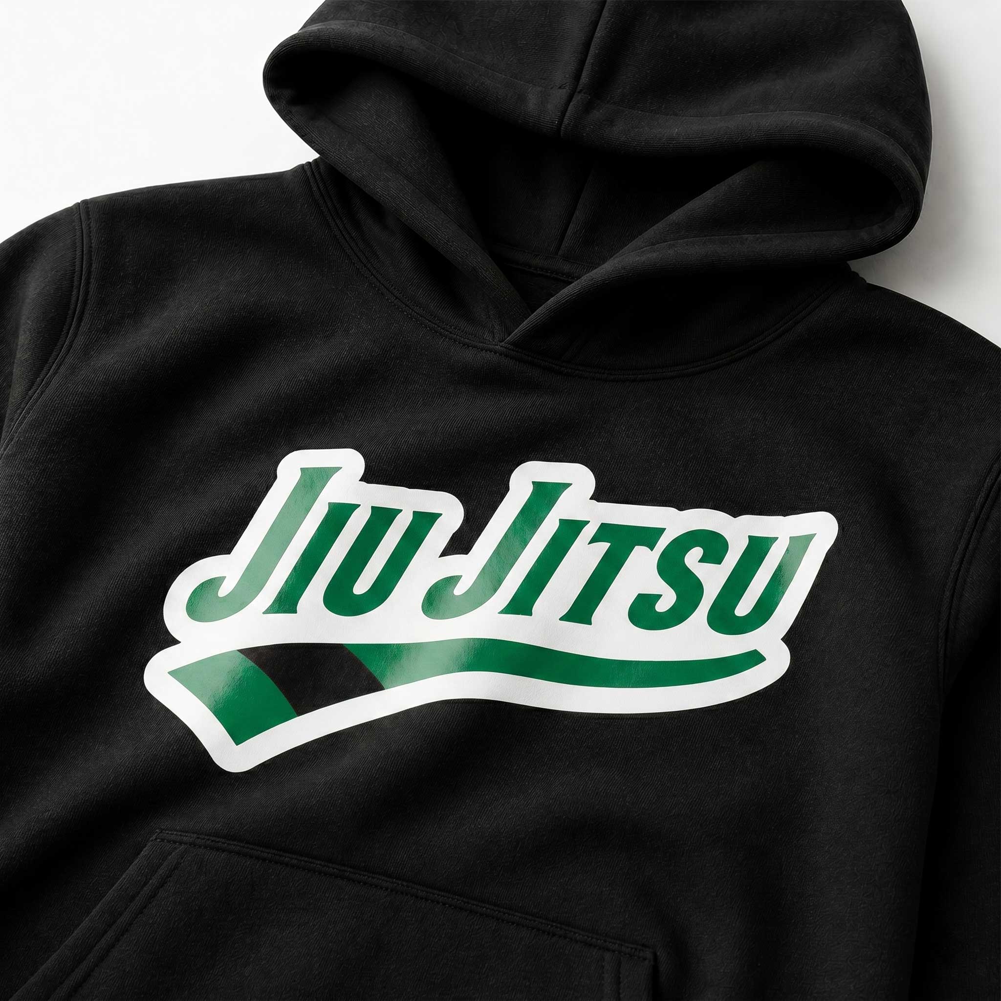 Close-up of green rank chest artwork on black Jiu Jitsu hoodie.