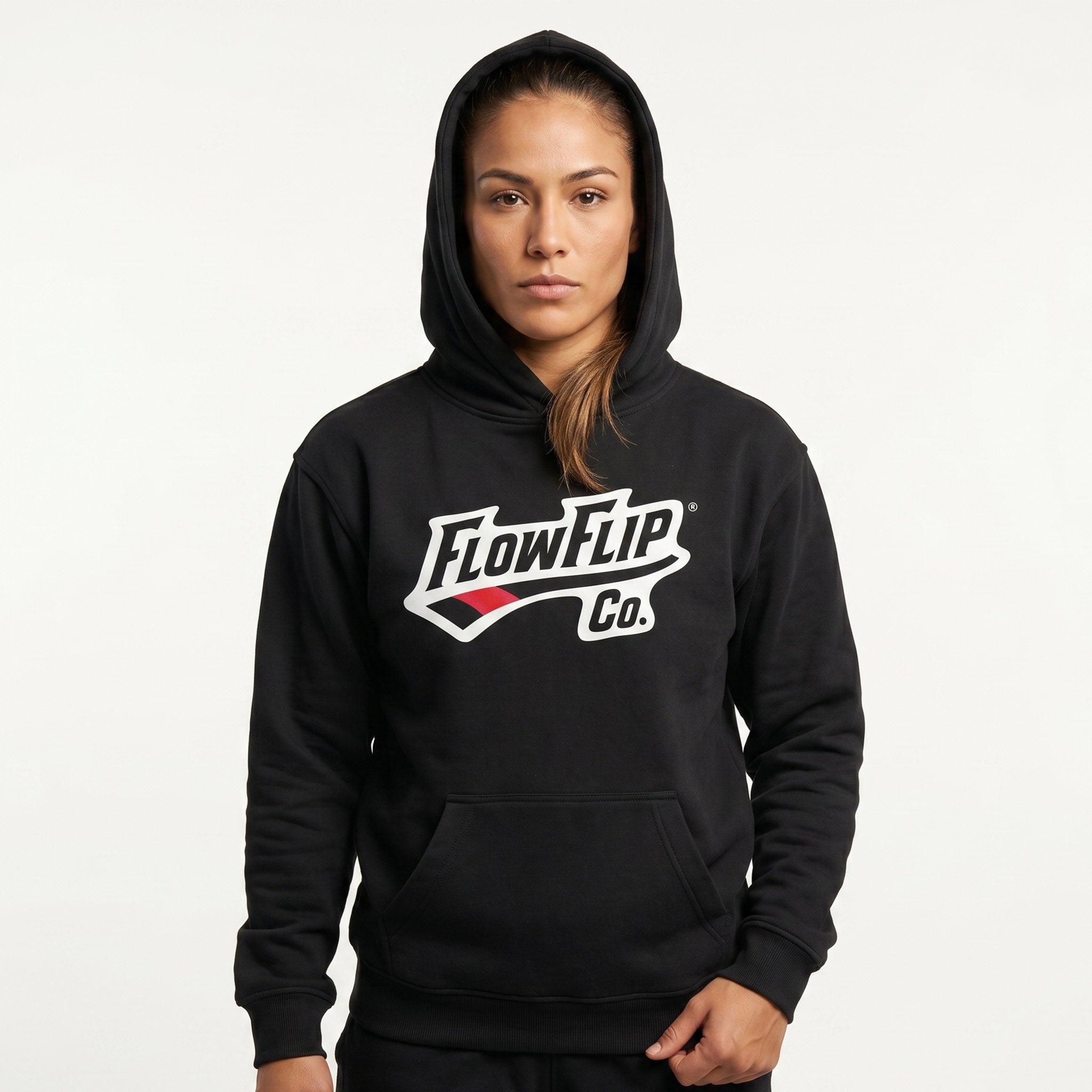Black Jiu Jitsu hoodie worn in studio with FlowFlip Co. chest logo visible.